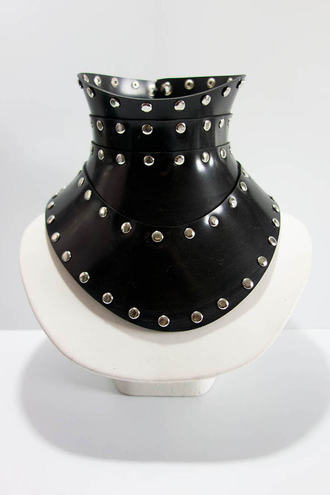 Black studded choker on a white background