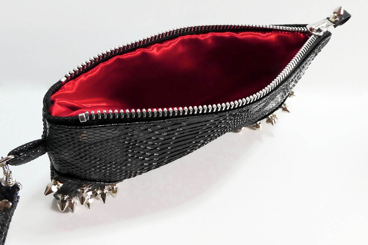 Clutch bag w/ spikes in Snake