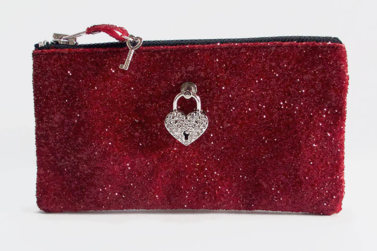 Red glittery pouch with a heart-shaped lock charm on a white background