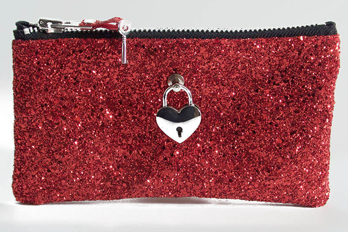 Red glittery pouch with a heart-shaped lock charm on a white background