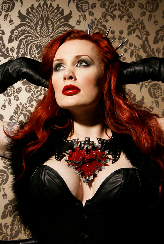 Dazzling giant red glitter heart necklace on a sexy pip-up model