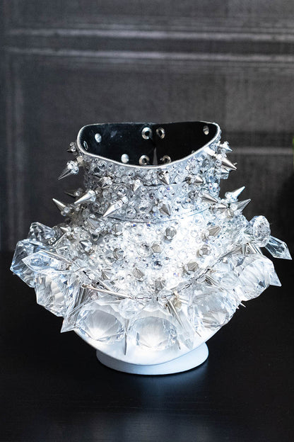 A luxurious silver leather posture collar necklace with black suede lining, adorned with genuine Swarovski crystals and dazzling spikes.