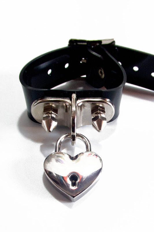 Black bracelet with metal heart-shaped padlock on a white background