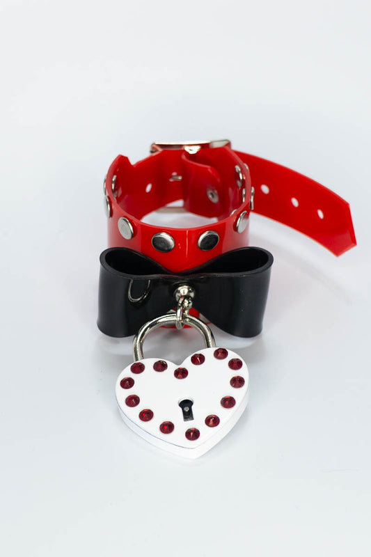 Red and black pvc bangle with a heart-shaped tag on a white background