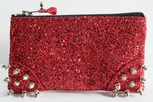 Red glittery pouch with silver spikes on a white background