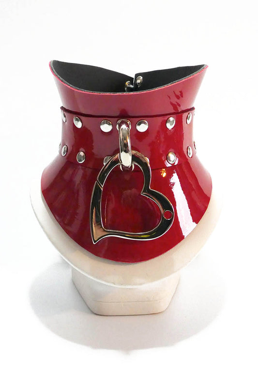 Red leather necklace with a heart-shaped silver lock on a white background