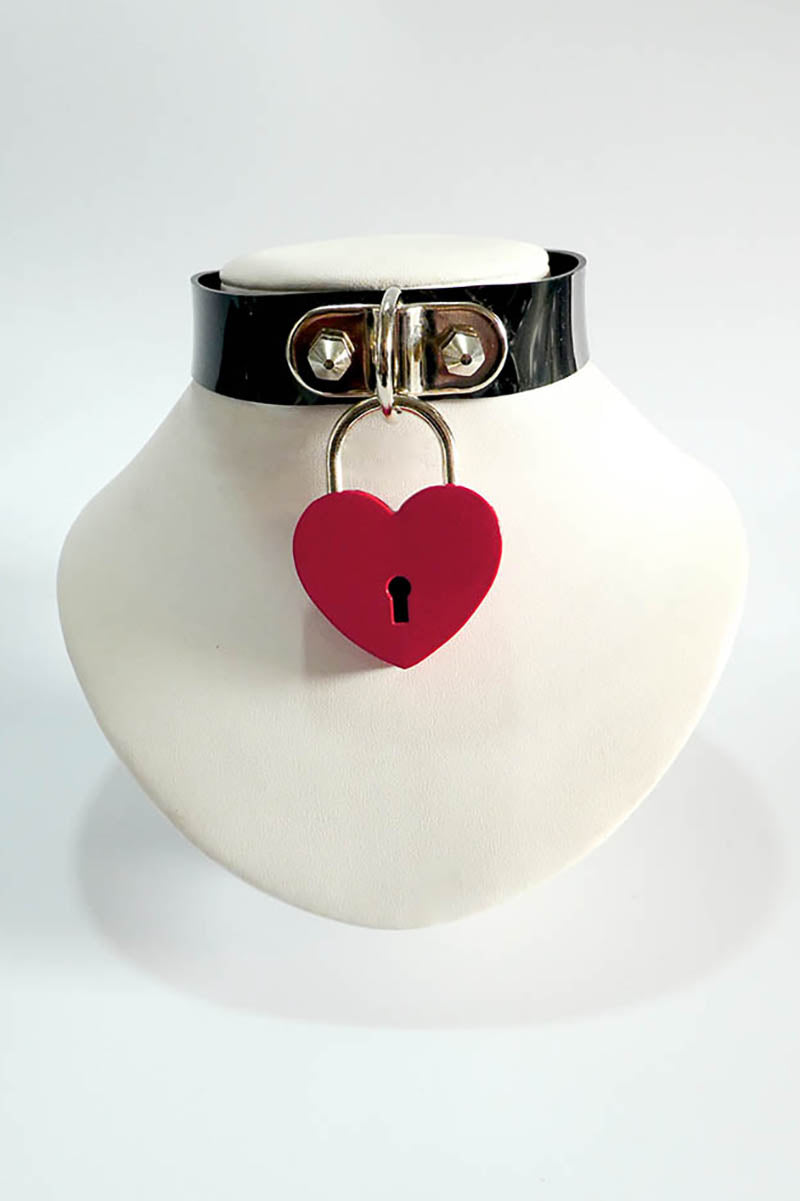Black rubber choker with a red heart-shaped lock on a white background