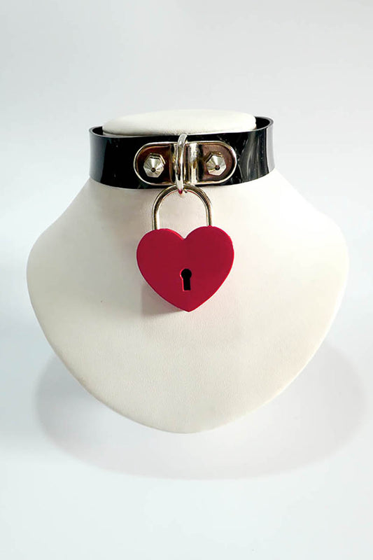 Black rubber choker with a red heart-shaped lock on a white background