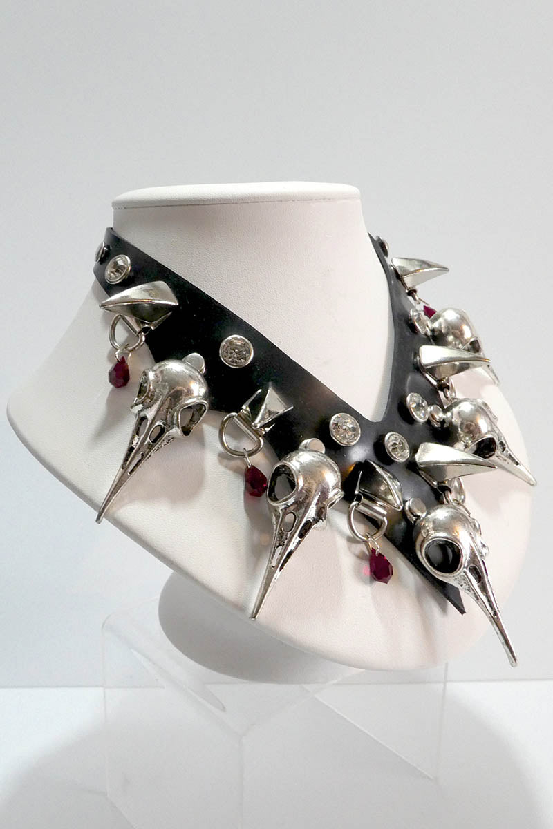 beautiful rubber and metal necklace with red crystals viewed form the side