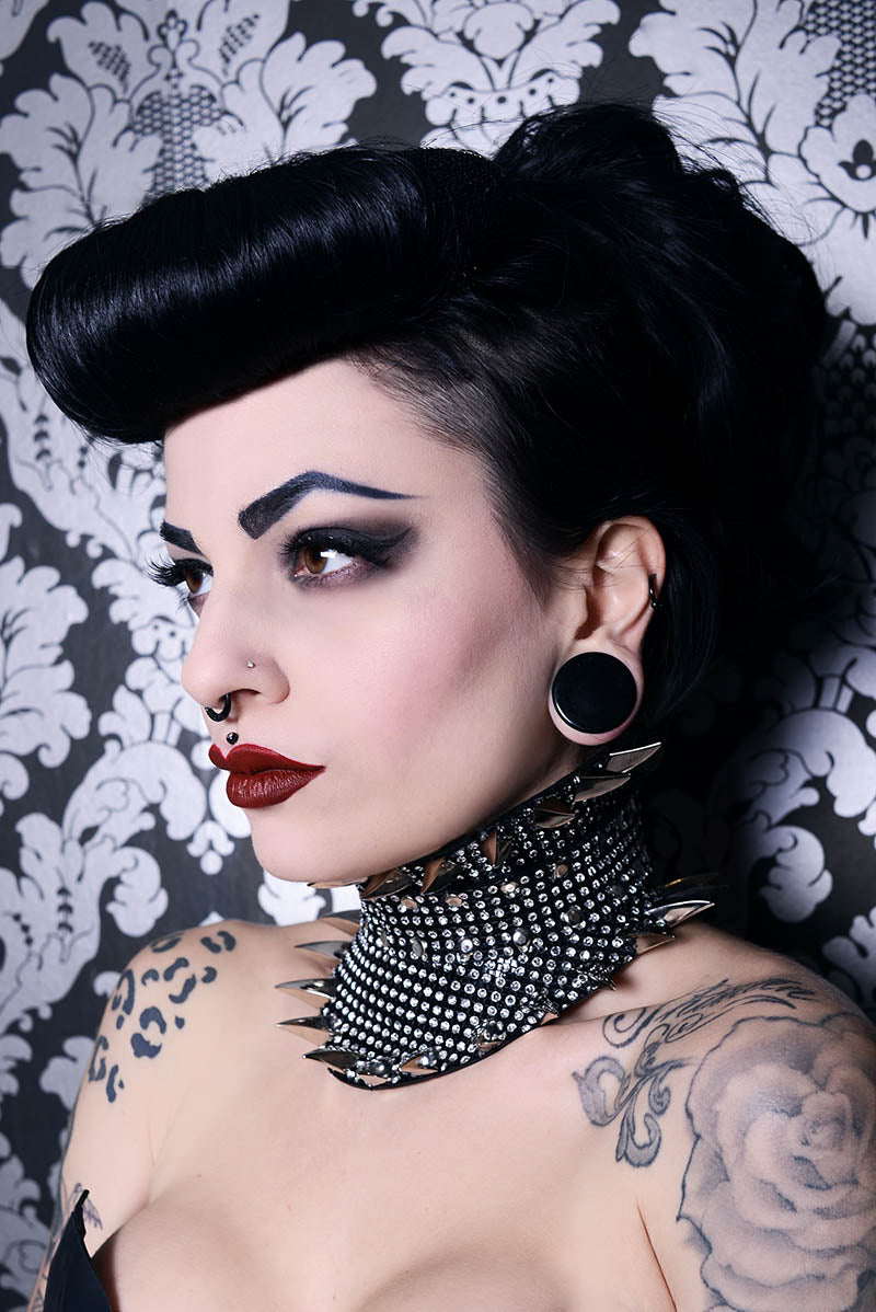 exquisite fetish posture collar with claws spike edges on a mistress model and flesh tunnels with perfect eyebrows