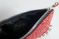Clutch bag w/ spikes in Glitter
