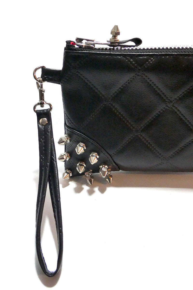 Clutch bag w/ spikes in Quilted Leatherette